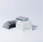 Eyelash extensions and a box with a brand label on a white background